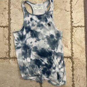 This is an Abercrombie kids tank top size 13 to 14 girls with a tie-dye pattern